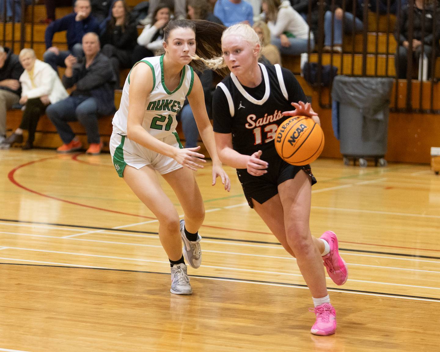 St. Charles East's Addie Schilb drive the baseline against York's Maggie Mikucki at the York Girl's Thanksgiving Tournament on Tuesday, Nov. 18,2025 in Elmhurst.