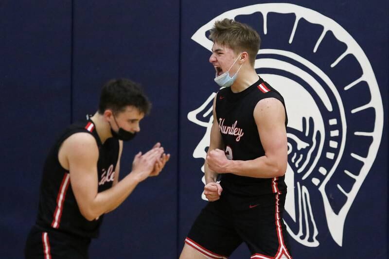 Huntley's Ben Ahmer and Aiden Wieczorek (right) celebrate against Cary-Grove on March 5, 2021 in Cary.