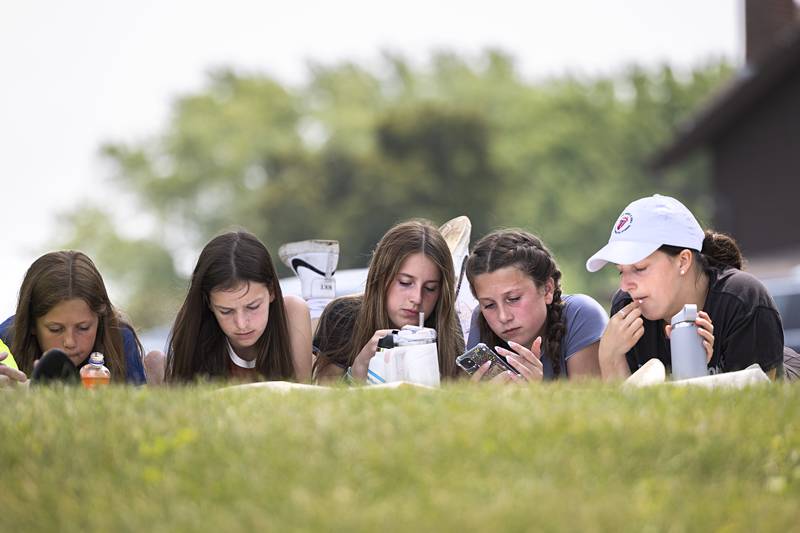 Stella (left), 10, Makenna, 12, Mackenzie, 15, Lucy, 12, and Makayla, 18 Wolfe hang out at Sewards Park Saturday, July 15, 2023 while waiting for the ski show to begin. The cousins were spending the weekend with grandparents Craig and Sue Wolfe.