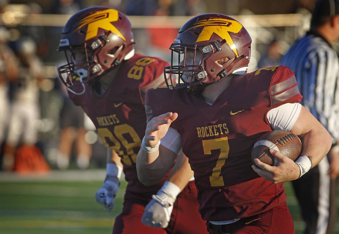 Richmond-Burton's Blake Livdahl (right) runs for a touchdown alongside his teammate,  Logan Johnson, during an IHSA Class 3A quarterfinal playoff football game against Monmouth-Roseville on Saturday, November 15, 2025, at Richmond-Burton High School, in Richmond.