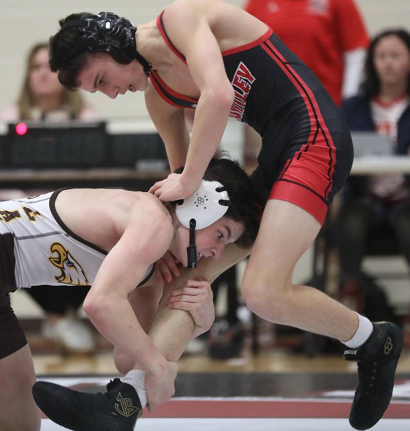 Jacobs’ Nathan Flaskamp tries to take down Huntley’s Anthony Pharis during the 113—pound match of a Fox Valley Conference wrestling meet on Thursday, Dec. 11, 2025, at Huntley High School.