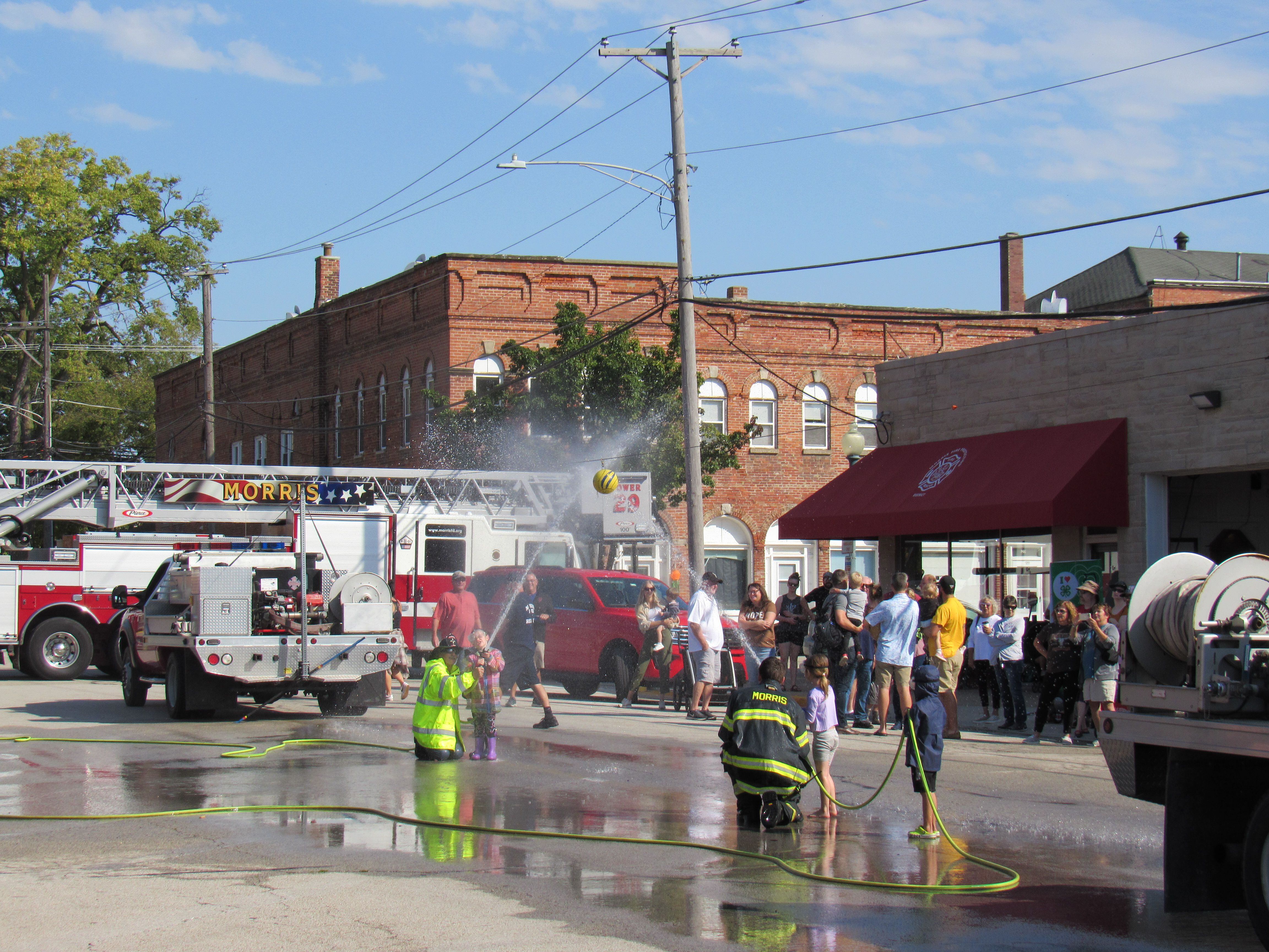 Kids compete in the kiddie water fights at the Grundy County Corn Festival.