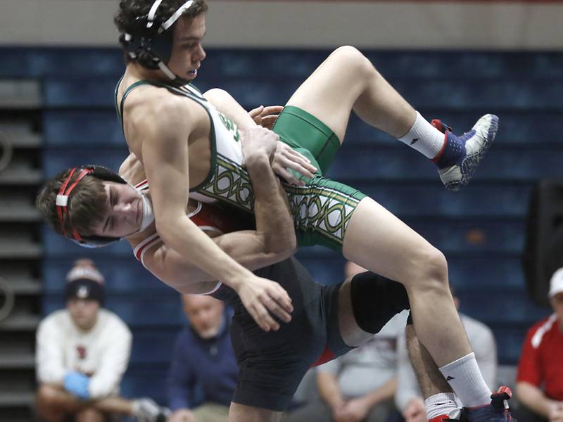 Marian Central's Vance Williams lifts St. Patrick's Benjamin Kusar in their 132-pound wrestling match Thursday, Jan. 19, 2023, at Marian Central High School in Woodstock.
