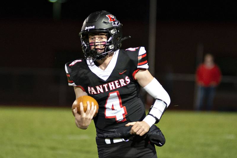 Erie-Prophetstown’s Jack Minssen picks up yards against Bureau Valley Friday, Oct.7, 2022.