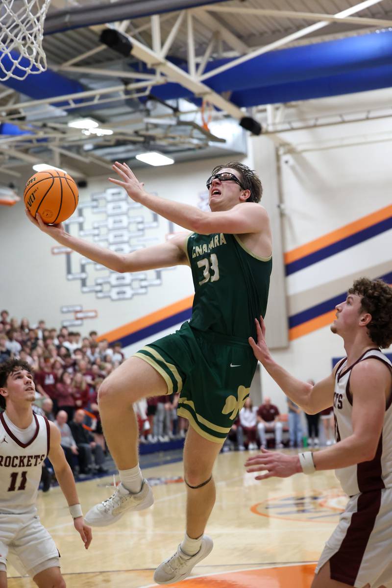 Bishop McNamara's Callaghan O'Connor goes to the basket during the Fightin' Irish's 77-70 loss to Tolono Unity in the IHSA Class 2A Pontiac Supersectional on Monday, March 9, 2026.