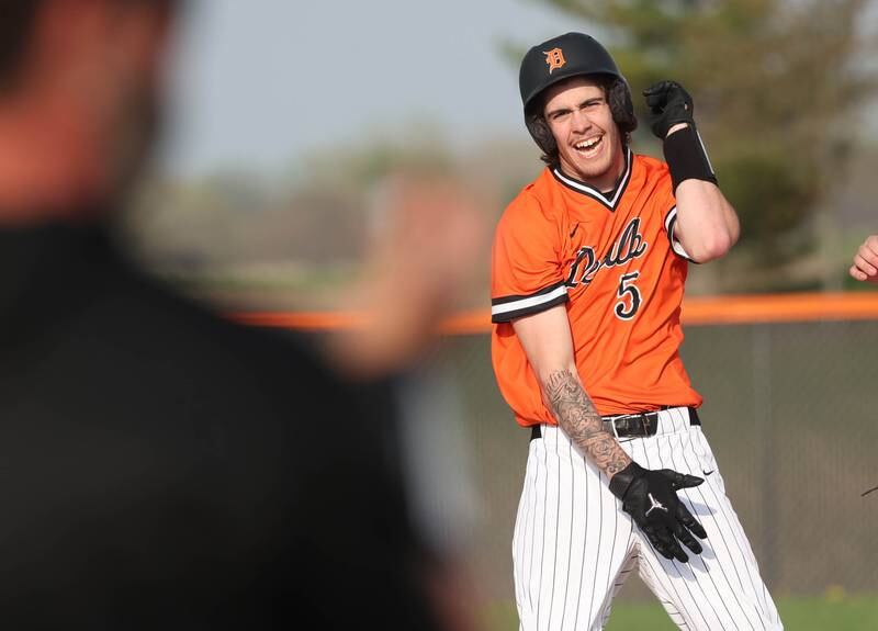 DeKalb's Cole Latimer celebrates after hitting a double Monday, April 28, 2025, during their game against Naperville Central at DeKalb High School.