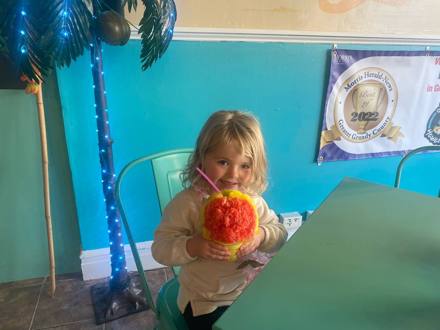 Chezel Brozavich, 3, enjoys her rainbow Hawaiian Ice.