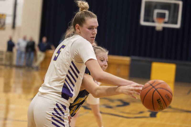 Polo’s Sydnei Rahn and Orangeville’s Whitney Sullivan go after a pass Tuesday, Feb. 21, 2023 in the sectional semifinal.