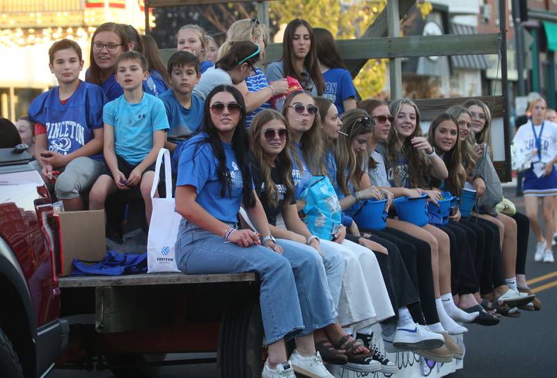 Princeton High School volleyball players ride a float in the Homecoming parade on Thursday, Oct. 3, 2024 downtown Princeton.