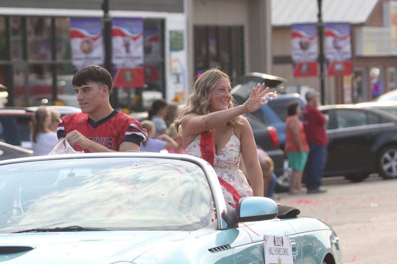 Hall homecoming king candidate Jack Curran and queen candidate Henna Doucette  ride during the Homecoming parade on Thursday, Sept. 18, 2025 downtown Spring Valley.