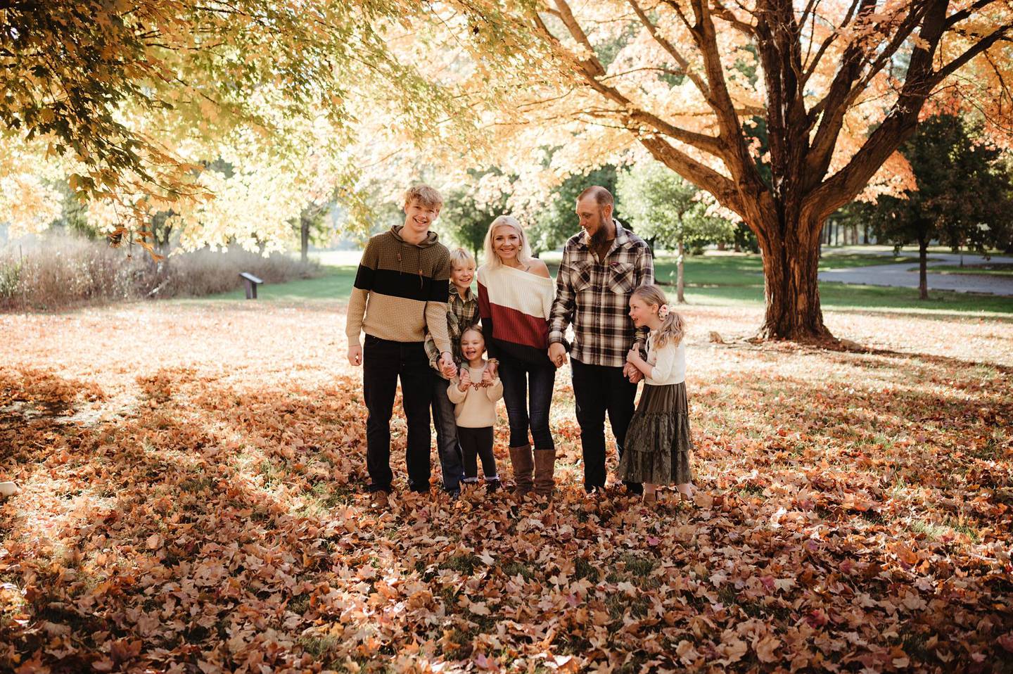 Jennifer and Nick Outerbridge stand with their children, from left, Caleb, 17, 
Noah, 10,  Gracie, 4, and Ella, 7, in a family photo.