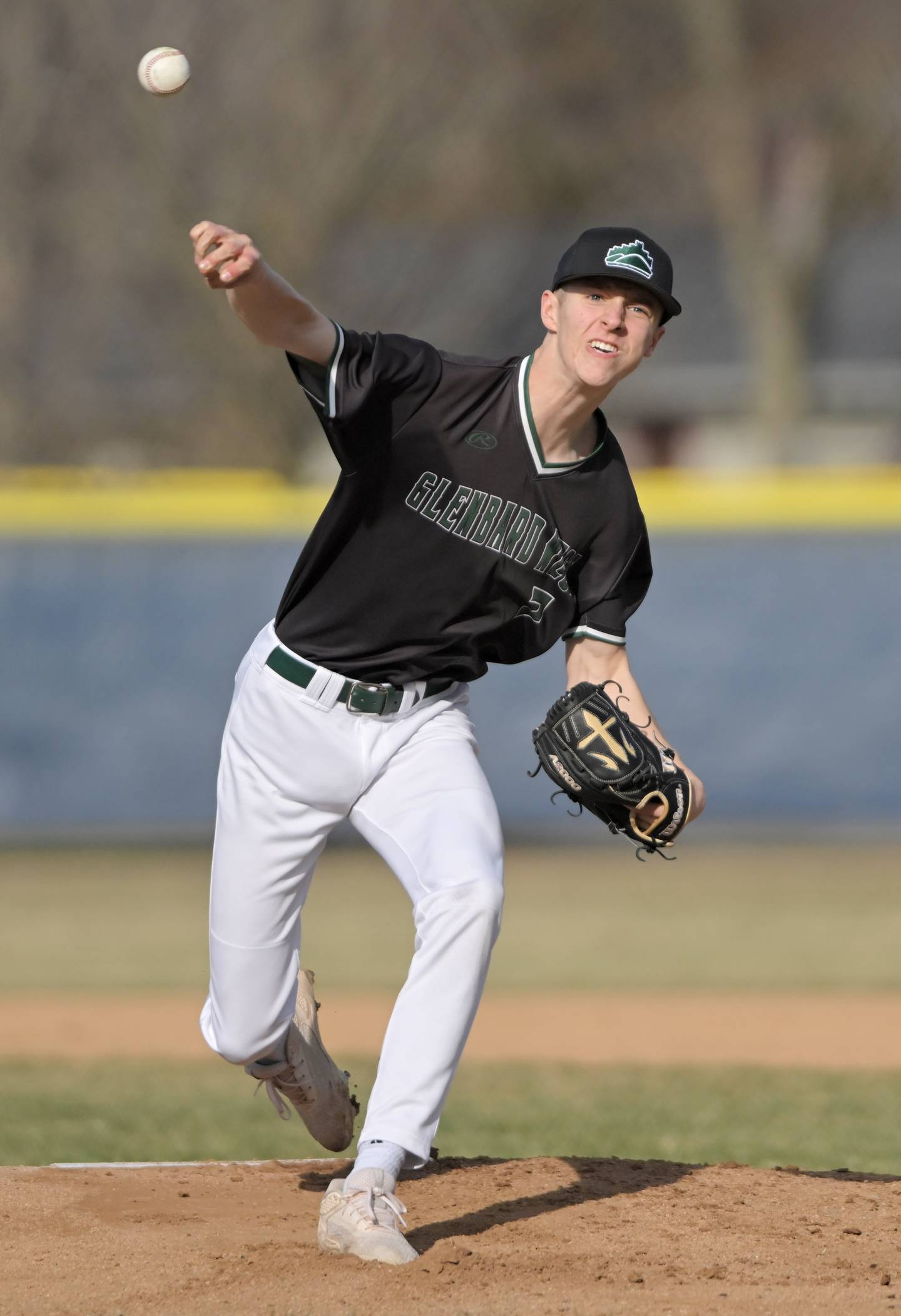 Glenbard West’s Tommy Lewison pitches against Geneva in a baseball game in Geneva on Wednesday, Mar. 25, 2026.