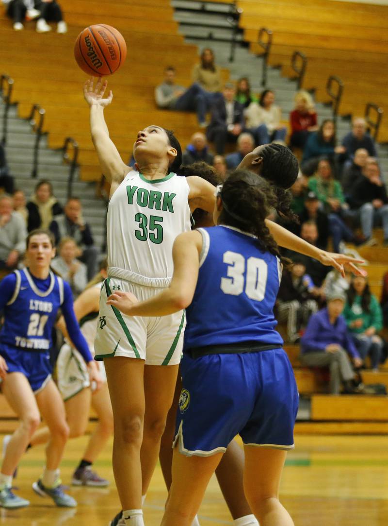 York's Angelina Downer (35) goes up for a rebound during the girls varsity basketball game between Lyons Township and York high schools on Friday, Dec. 16, 2022 in Elmhurst, IL.
