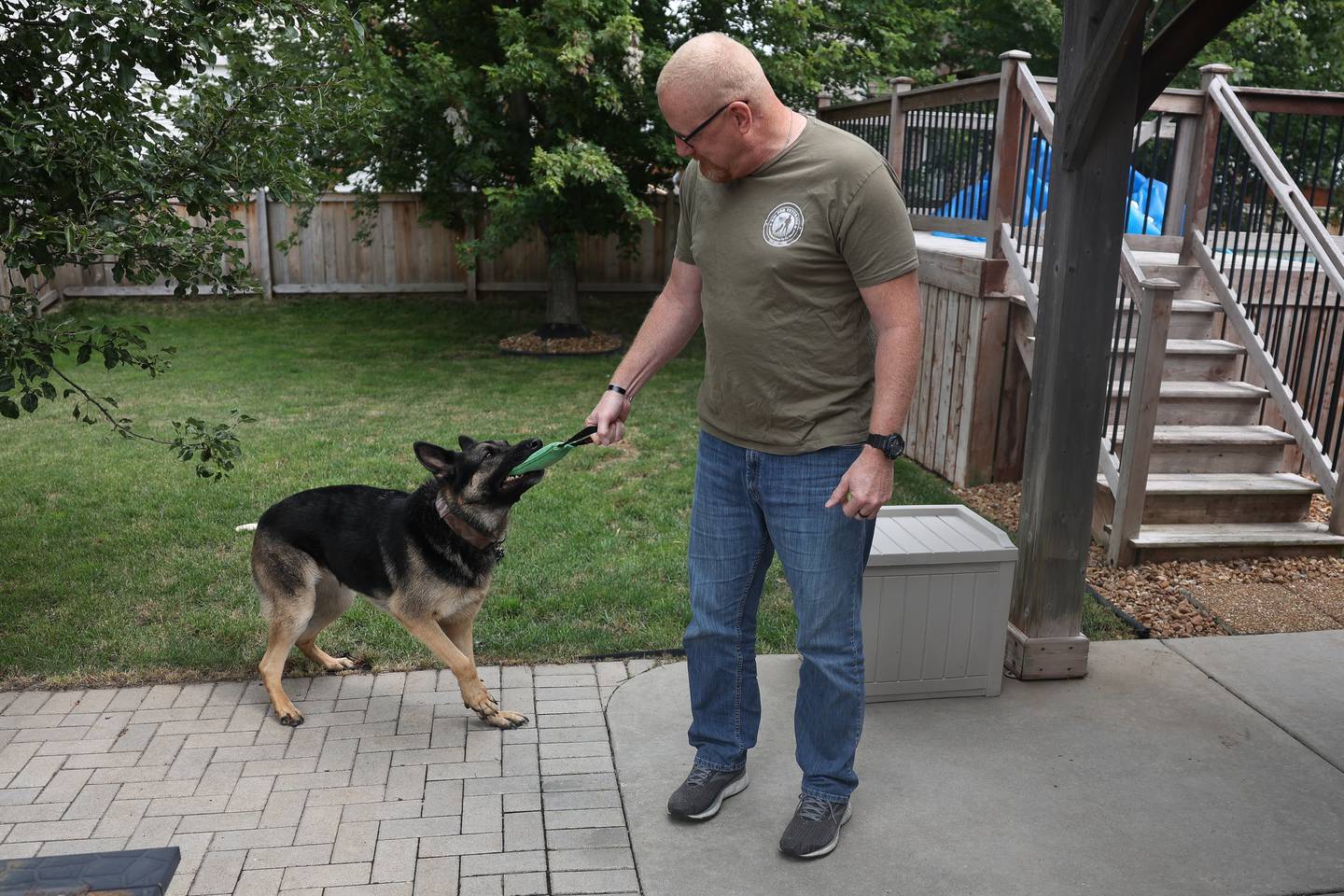 Dan Miller, with the Wounded Warriors Project and K9s for Veterans, plays with his service dog Rocky at his home on Wednesday, July 24, 2024 in Joliet.