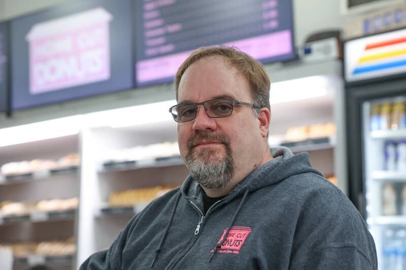 Owner Jim Ruhaak poses for a photo at his Home Cut Donuts location on Jefferson Street, Saturday, March 25, 2023 in Joliet.