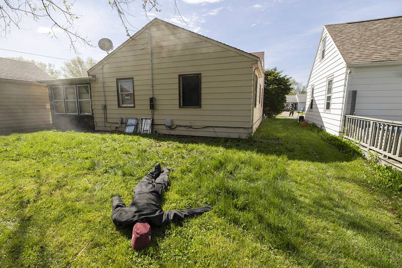 A rescue dummy is left in the backyard of a house Wednesday, May 1, 2024 after a fire training session in Rock Falls was disrupted due to a house fire on the other side of town.