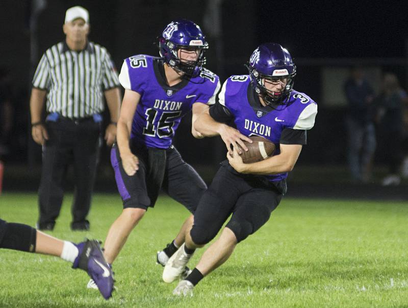 Dixon’s Rylan Ramsdell takes the handoff from QB Tyler Shaner Friday, Sept. 16, 2022 against Stillman Valley.