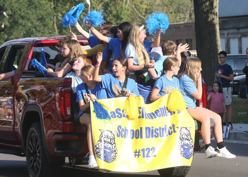 La Salle elementary school cheerleaders ride during the L-P homecoming parade on Thursday, Oct. 2, 2025 downtown Peru.