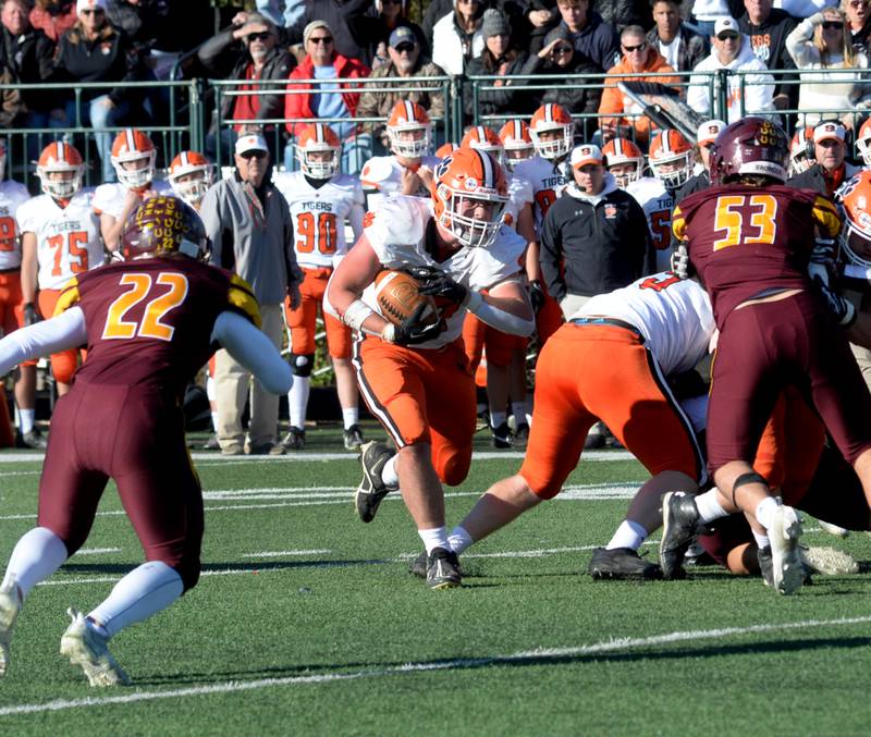 Byron's Caden Considine (37) runs for a gain against Lombard-Montini  in 3A semifinal action in Lombard on Saturday, Nov. 18, 2023.