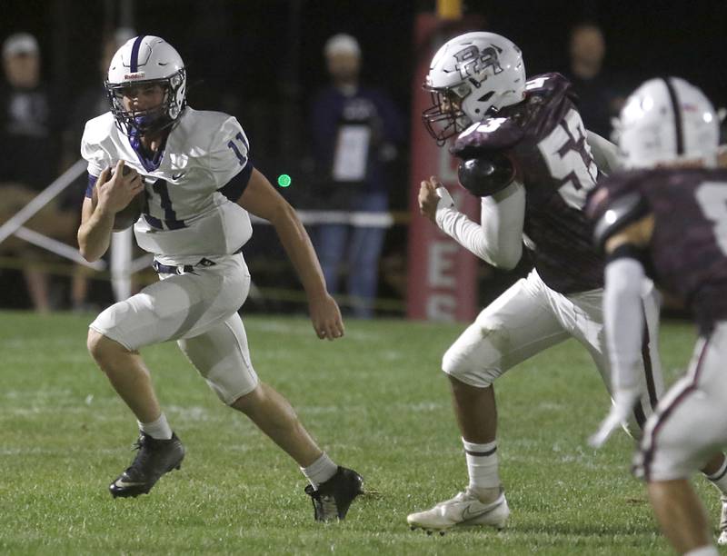 Cary-Grove's Peyton Seaburg runs with the ball as he is chased by Prairie Ridge's Jose Esparza during a Fox Valley Conference football game on Friday, Sept. 27, 2024, at Prairie Ridge High School.