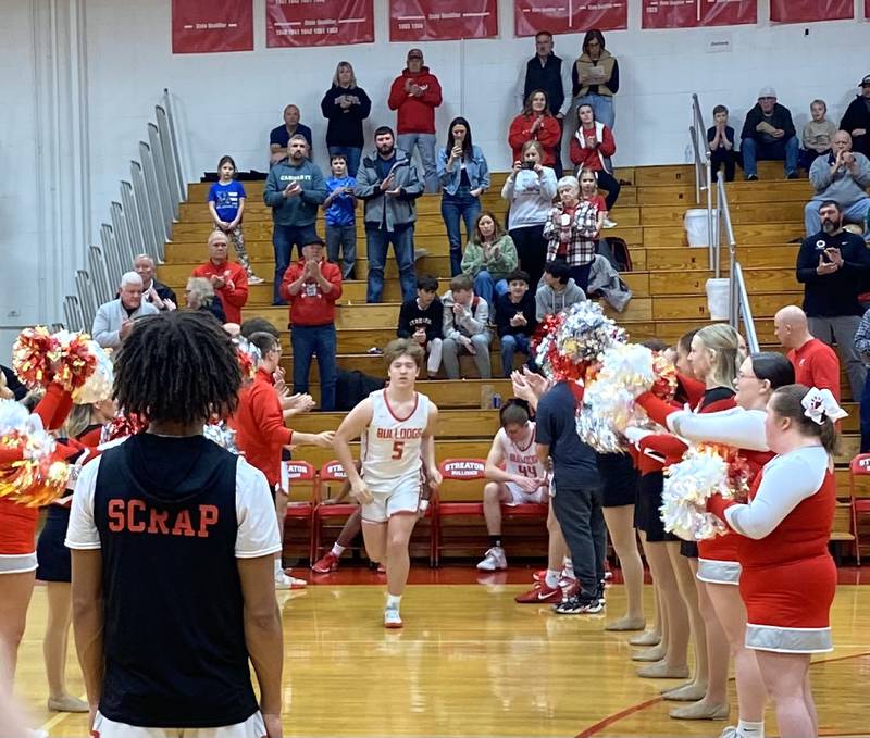 Isaiah Weibel (5) takes the Pops Dale Gymnasium floor during pregame introductions Saturday, Feb. 1, 2025 in Streator.
