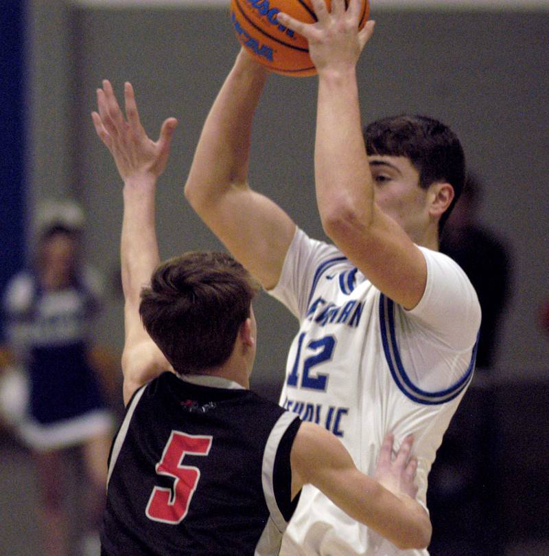 Newman's Evan Bushman shoots over E-P's Walker Wright. The Newman Comets hosted the Erie-Prophetstown Panthers in a Conference game. played at Newman High School on February 6, 2026.
