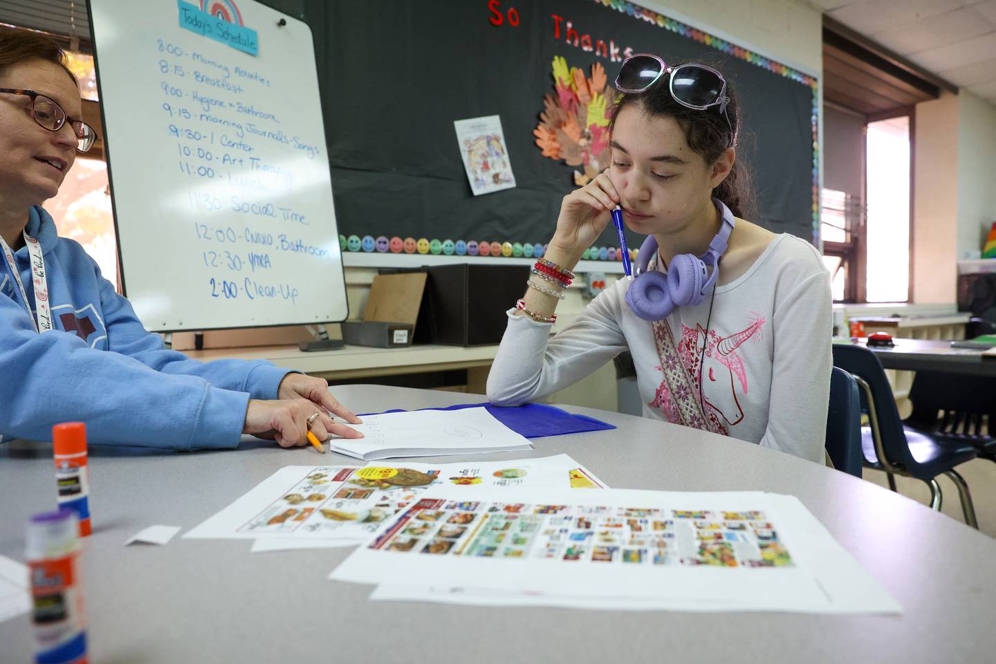 Kankakee School District student Dinevera Davis works on a grocery shopping exercise with teacher Jennifer Carroll, left, at Avis Huff Student Support Services Center on Thursday, Nov. 13, 2025.