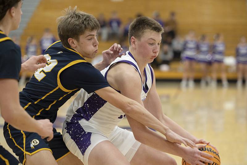 Rochelle’s Eli Schweitzer handles the ball against Sterling’s Jack Saathoff Saturday, Jan. 3, 2026.