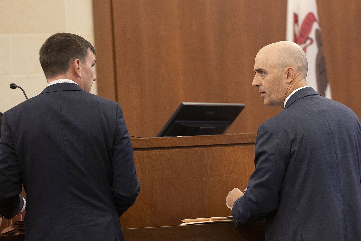 Ogle County Assistant State’s Attorney Matthew Leiston (right) speaks with Brad Thomson, Jodie Wiederkehr’s attorney, Wednesday, October 1, 2025.