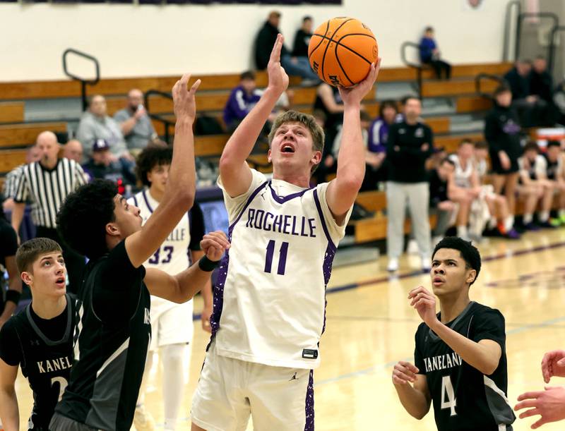 Rochelle's Brody Bruns goes to the basket against Kaneland's Evan Frieders Tuesday, Feb. 3, 2026, during their game at Rochelle High School.