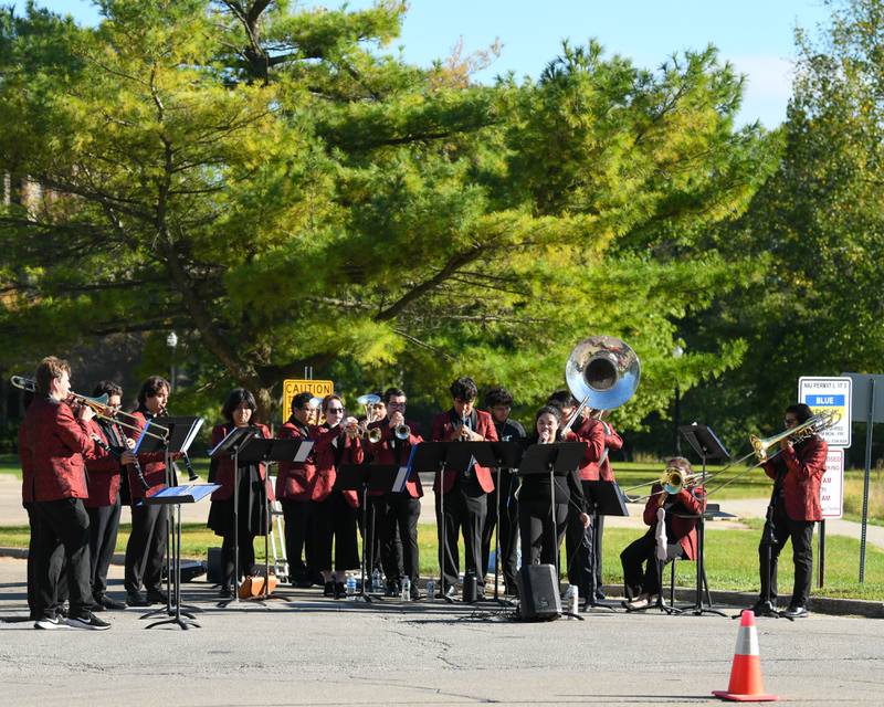 Northern Illinois University's Banda NIU performs on the route of the DeKalb Corn Classic 5K/10K  run on Sunday, Sept. 29, 2024, held in downtown DeKalb.