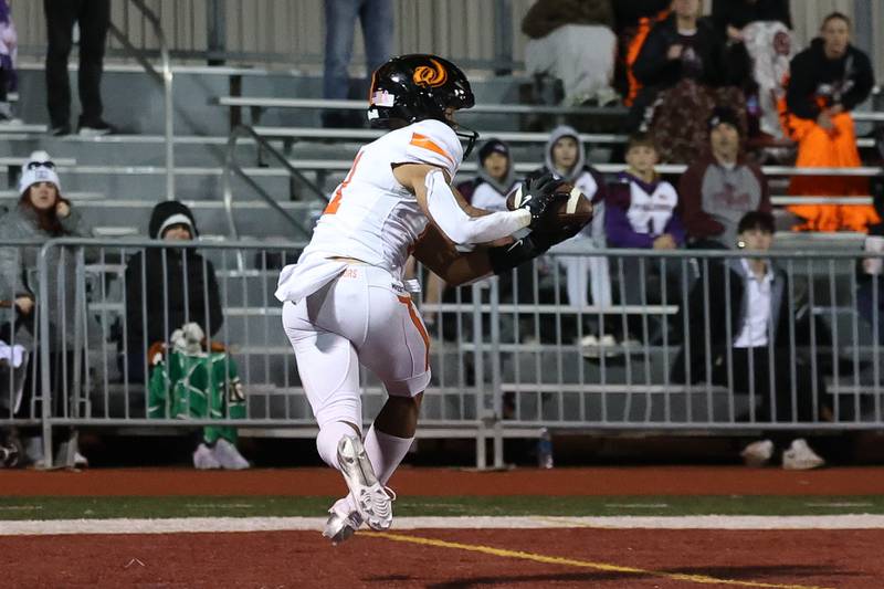 Lincoln-Way West’s Austin Rowswell pulls in the game winning 2-point conversion in overtime against Lockport on Friday, Oct. 18, 2024 in Lockport.