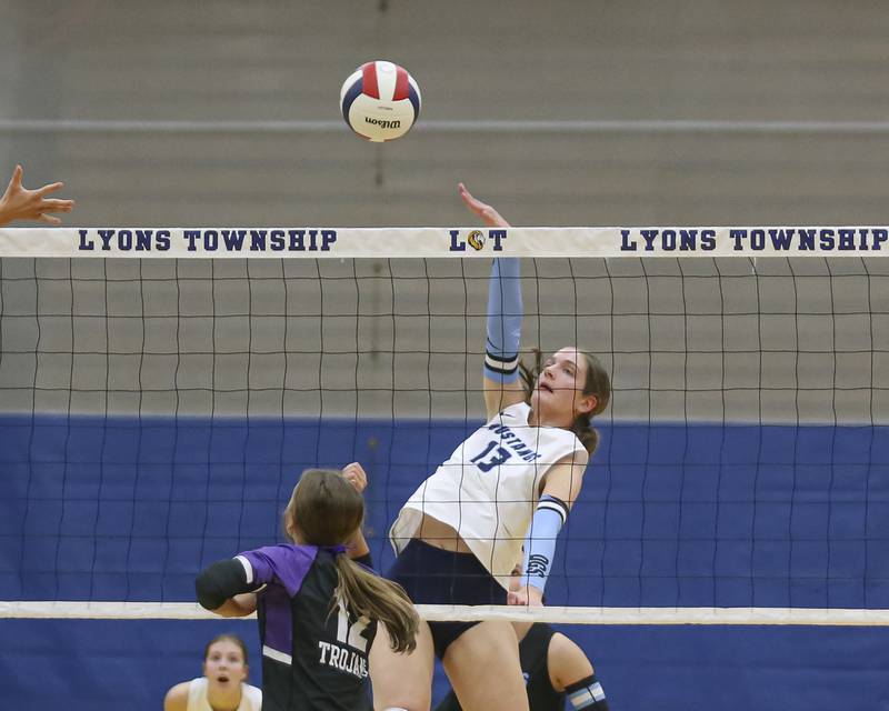 Downers Grove South's Lauren Curran (13) spikes the ball during Class 4A Lyons Sectional Semifinal volleyball match between Downers Grove South at Downers Grove North. Nov 4, 2025 in La Grange.