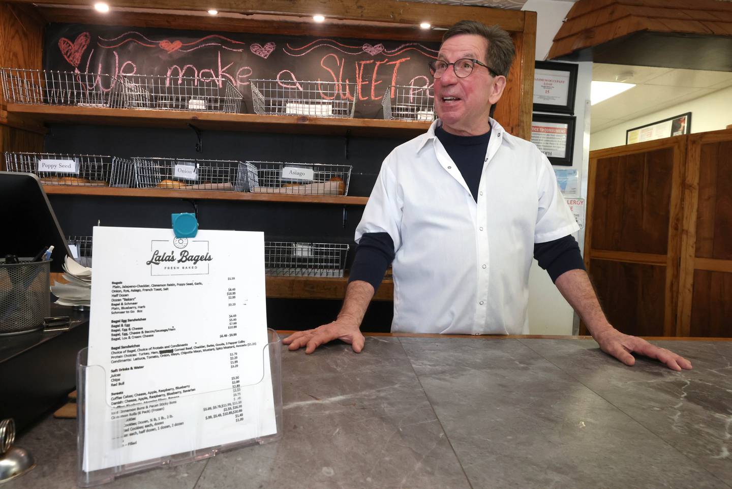 Lala’s Bagels co-owner Gerry McMahon talks Thursday, Feb. 12, 2026, at the store, about the preparations for Paczki Day, their busiest day of the year.
