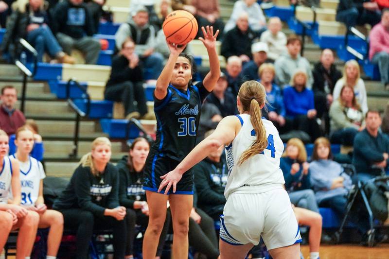 St. Charles North's Lelanie Posada (30) shoots a 3-pointer against Geneva’s Frances Rose Myszkowski (24) during a game at Geneva High School on Thursday, Dec. 4, 2025.
