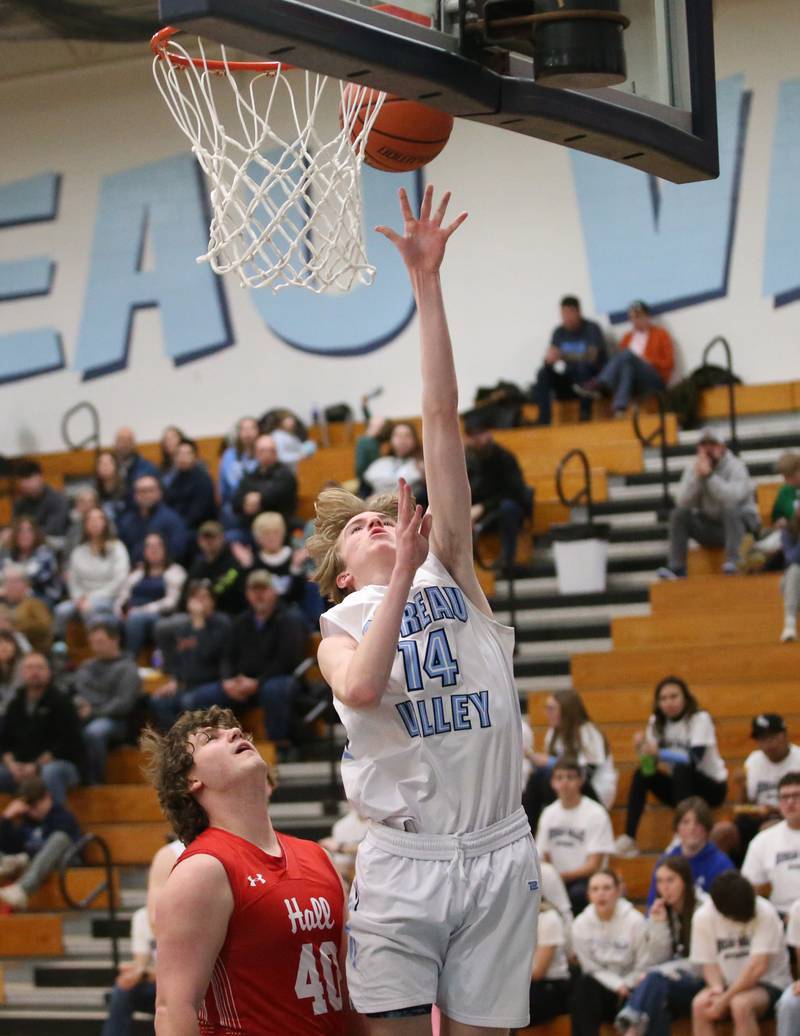 Bureau Valley's Justin Moon sinks a layup over Hall's Payton Dye on Friday, Jan. 19, 2024 at Bureau Valley High School.