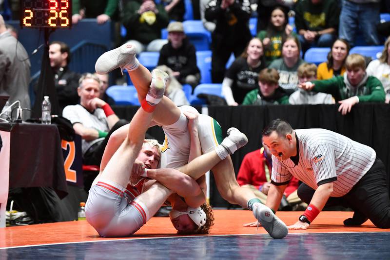 Brody Widlowski of Coal City and Brody Matthews of Vandalia wrestle in the 138-pound match during the IHSA Dual Team State Finals in Bloomington on Saturday, March 1.