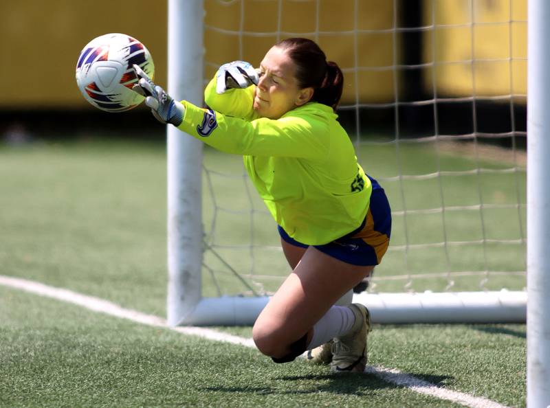 Johnsburg’s goalkeeper Lila Konrad makes a penalty kick save against Willows Academy in IHSA Class 1A Supersectional soccer action at Dominican University in River Forest on Saturday, May 31, 2025.