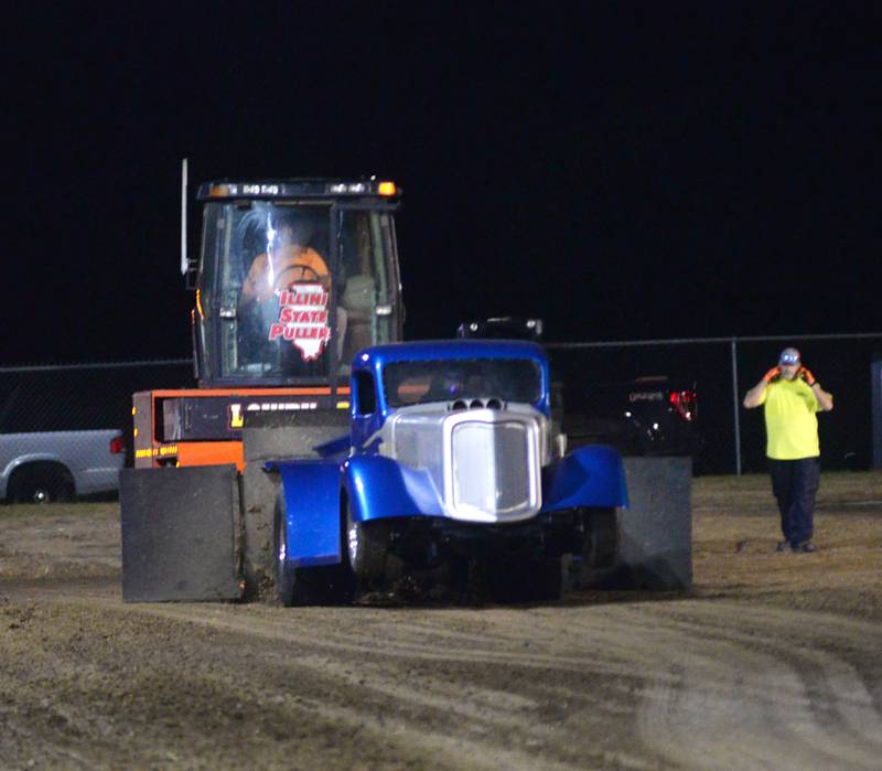 Tom Venhuizen of Morrison begins his run in his 36 Chevy, The Fun In, during competition in the 650 open division of the Illini Truck & Tractor Pulls at the Ogle County Fair on Thursday, Aug. 1, 2024.