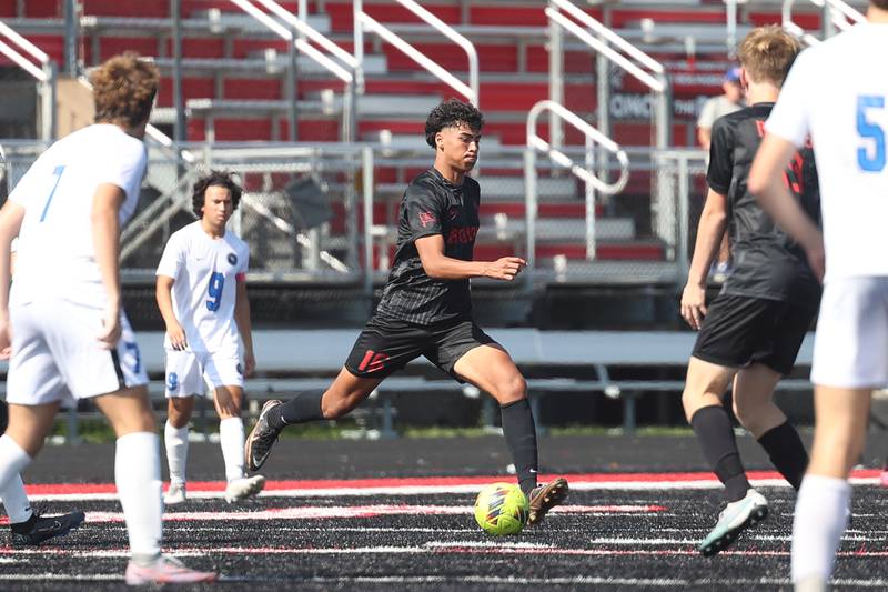 Bolingbrook’s Aaron Palacios-Chaves takes the ball across midfield against Lincoln-Way East on Saturday, Sept. 30, 2023 in Bolingbrook.