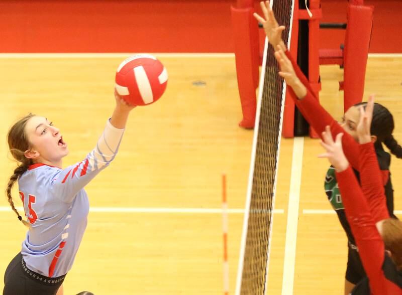 Ottawa's Addison Duggan sends the ball past L-P's Ava Currie and Addison Duttlinger on Thursday, Sept. 21, 2023 at Kingman Gym.