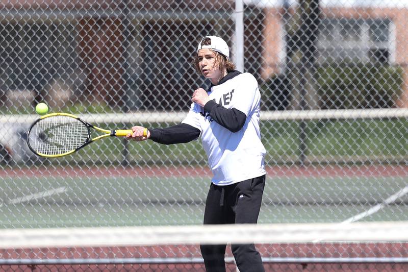 Joliet Township’s Joseph O’Brien returns a shot in a double match on Saturday, April 6, 2024 in Joliet.