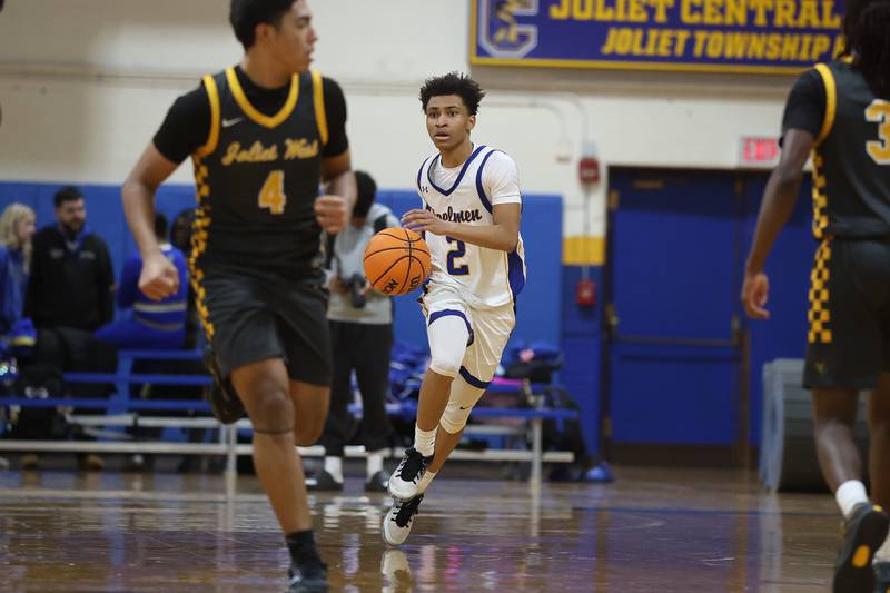 Joliet Central’s Kaden Henry works the ball up court against Joliet West on Thursday, Jan. 15, 2026 in Joliet.