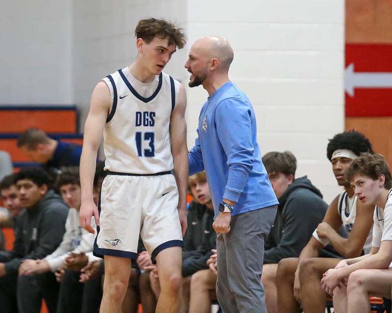 Downers Grove South's head coach Zach Miller gives instructions to Josh Erdal (13) during their Class 4A Naperville North Regional final basketball game between Yorkville at Downers Grove South, Feb 27, 2026 in Naperville.