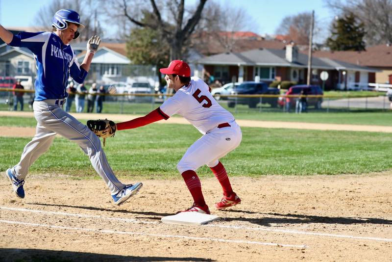 Hall first baseman Dom Galetti tries to tag out Princeton's Noah LaPorte on a bunt, but the throw got past him in Thursday's game at Kirby Park.
