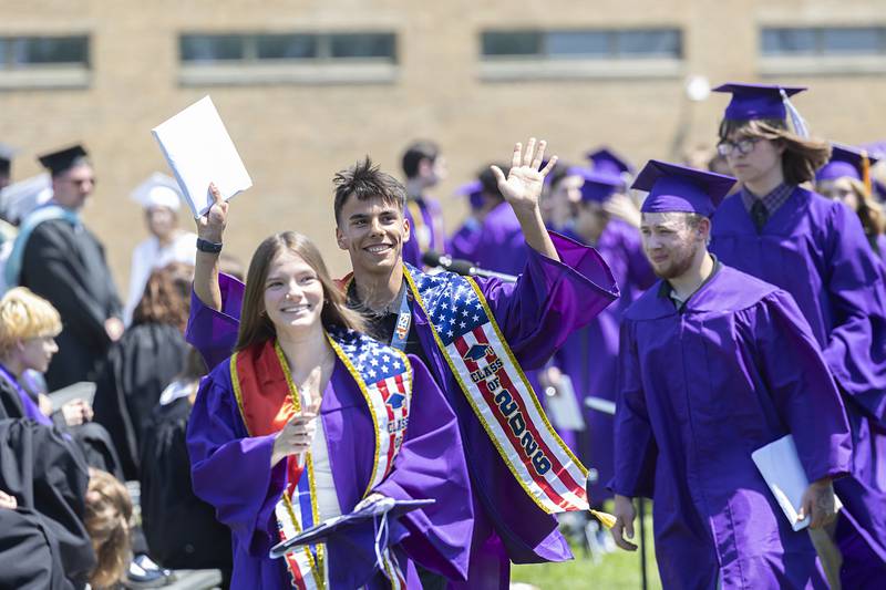 Dixon High School graduates leave the field and wave to loved ones after receiving their diplomas Sunday, May 24, 2026.