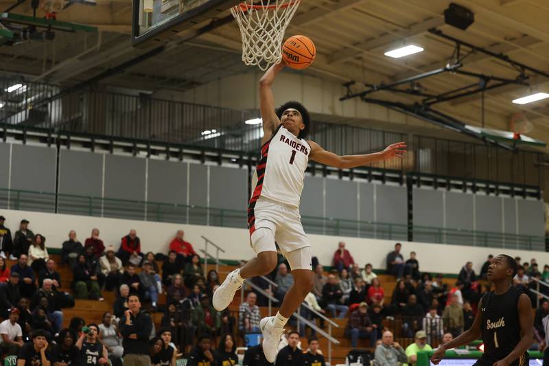 Bolingbrook’s Brady Pettigrew goes in for the dunk against Hinsdale South in the 50th Annual Jack Tosh Holiday Classic on Thursday, Dec. 26, 2024 at York High School.