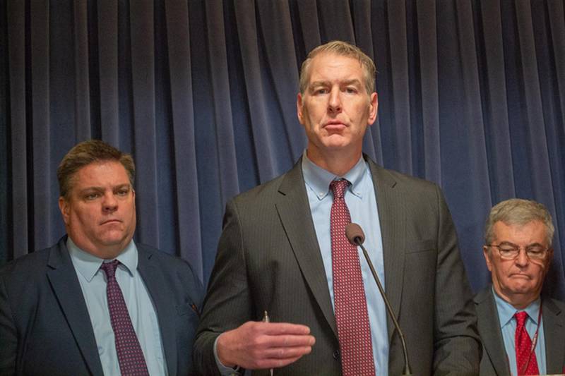 Senate Minority Leader John Curran (center) appears with fellow GOP Sens. Chapin Rose (left) and Tom Bennett (right) at a Statehouse news conference on Tuesday.