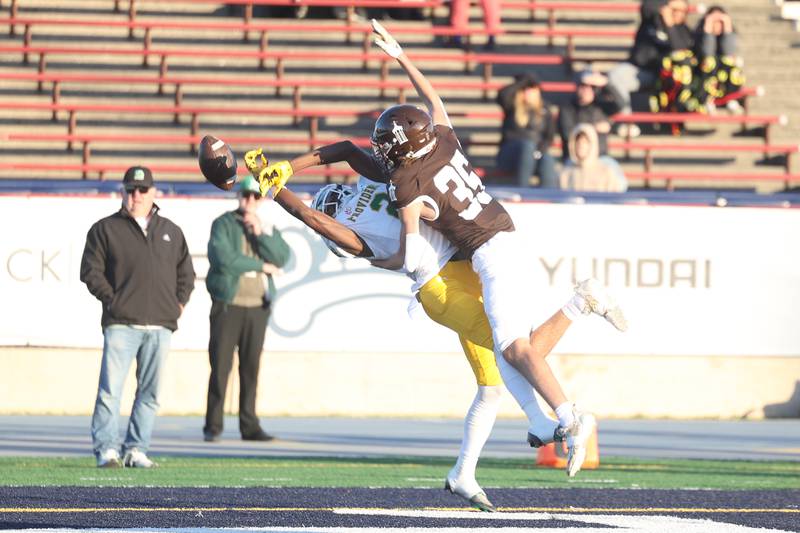 Providence’s Xavier Coleman stretches for the ball while being blanketed by Joliet Catholic’s Michael Jaworski in the Class 5A semifinal on Saturday, Nov. 18, 2023, in Joliet.