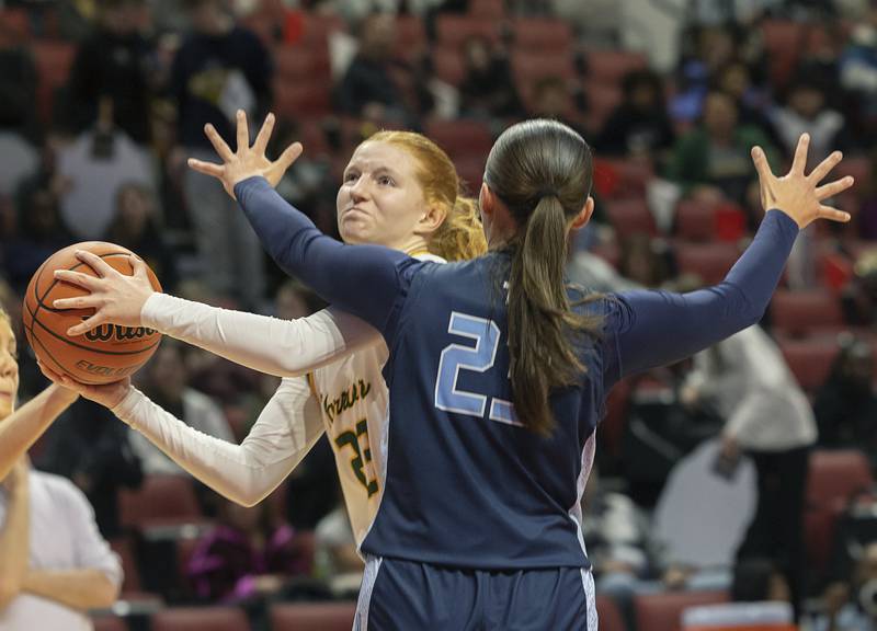 Waubonsie Valley’s Lily Newton goes to the hoop against Nazareth Academy’s Danielle Scully Friday, March 1, 2024 in the girls basketball 4A state semifinal at CEFCU Arena in Normal.